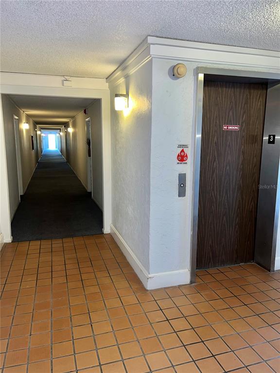 519 Albee Farm Road, Unit 303 Venice, FL 34285 - Photo 6 of 58 a view of a hallway with wooden floor