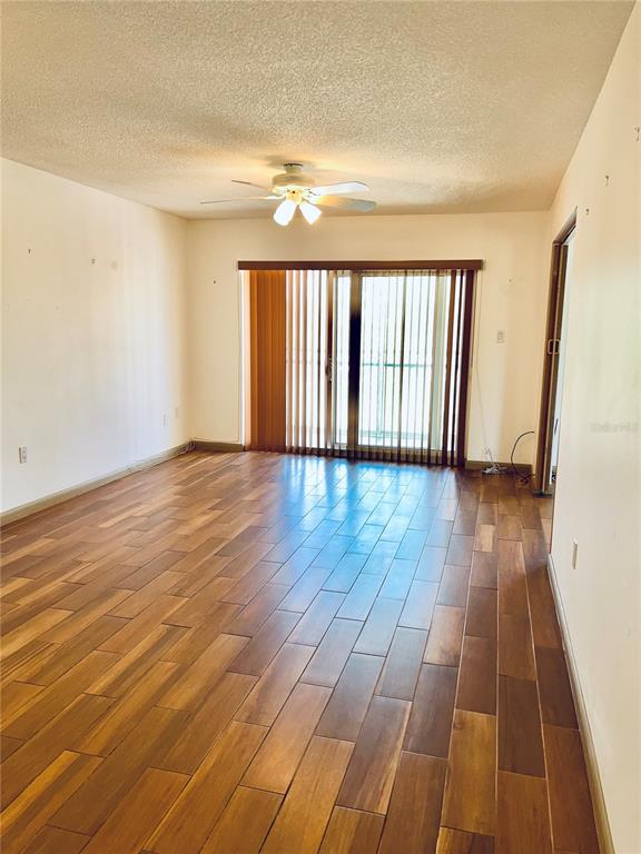 519 Albee Farm Road, Unit 303 Venice, FL 34285 - Photo 9 of 58 a view of wooden floor in a room