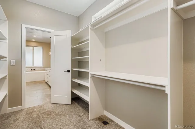 a view of an empty walk in closet