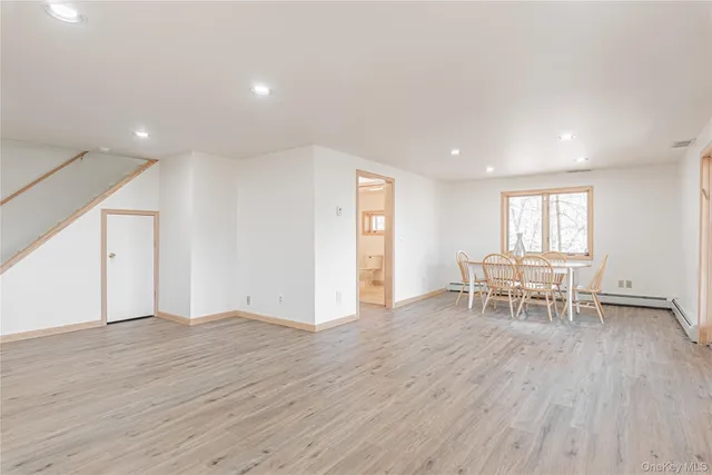 a view of a livingroom with furniture and window