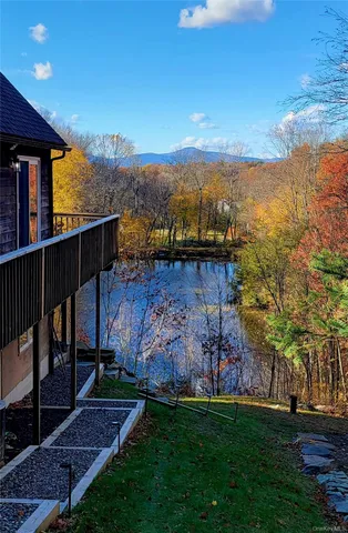a view of a terrace with yard and wooden fence