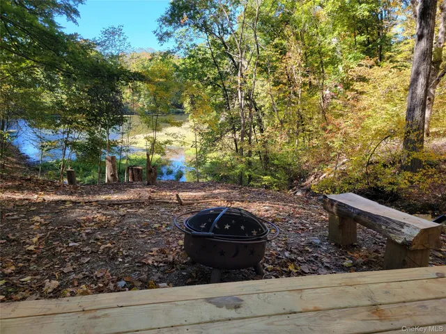 a backyard of a house with a yard and lake view