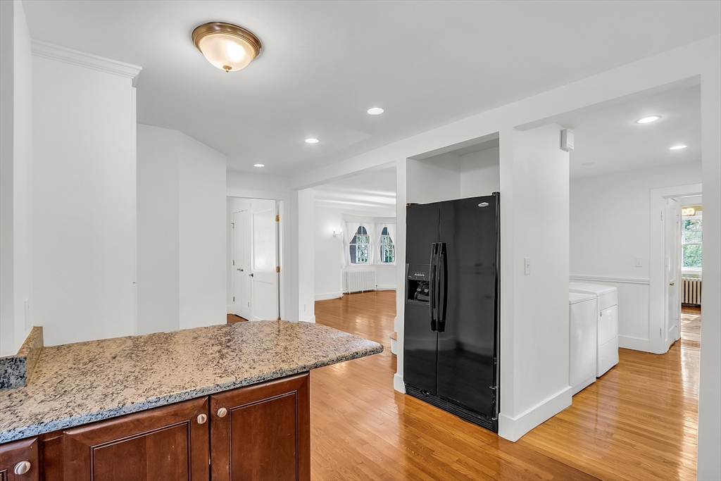 42 Locust Street Marblehead, MA 01945 - Photo 18 of 42 a kitchen with stainless steel appliances granite countertop cabinets and wooden floor