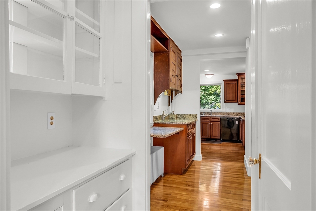 42 Locust Street Marblehead, MA 01945 - Photo 20 of 42 a kitchen with granite countertop a sink and cabinets