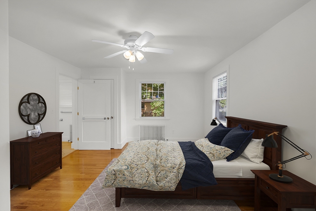 42 Locust Street Marblehead, MA 01945 - Photo 21 of 42 a bedroom with a bed and a chandelier