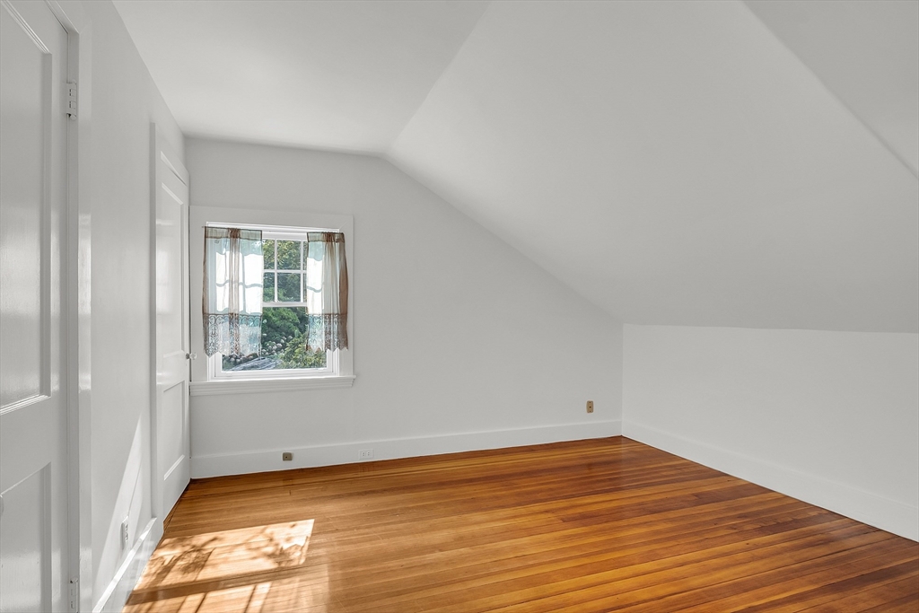 42 Locust Street Marblehead, MA 01945 - Photo 28 of 42 an empty room with wooden floor and windows