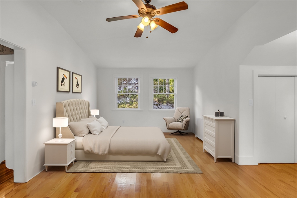 42 Locust Street Marblehead, MA 01945 - Photo 33 of 42 a bedroom with a bed and wooden floor