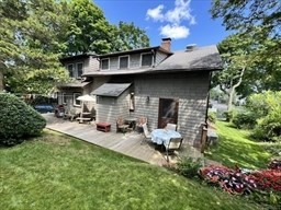 42 Locust Street Marblehead, MA 01945 - Photo 5 of 42 a view of a chair and tables in the back yard of the house
