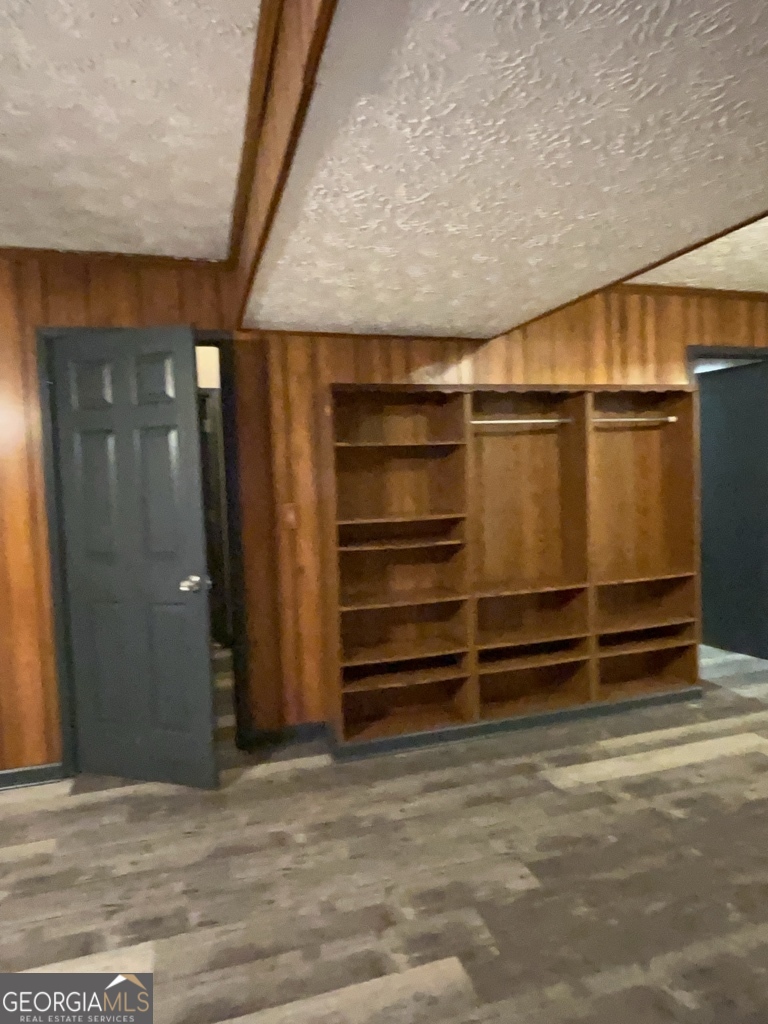1265 Herrington Road Lawrenceville, GA 30044 - Photo 36 of 52 a view of room with walk in closet
