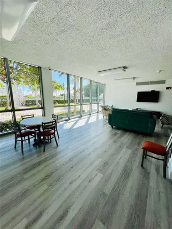 a view of dining room with furniture and wooden floor