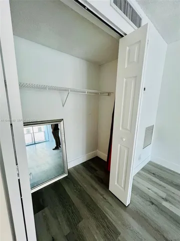 a view of entryway with wooden floor