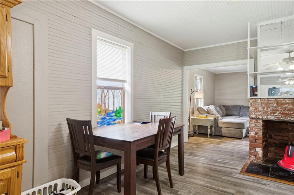 400 Sam Love Road Rocky Face, GA 30740 - Photo 16 of 29 a dining room with furniture wooden floor and a rug