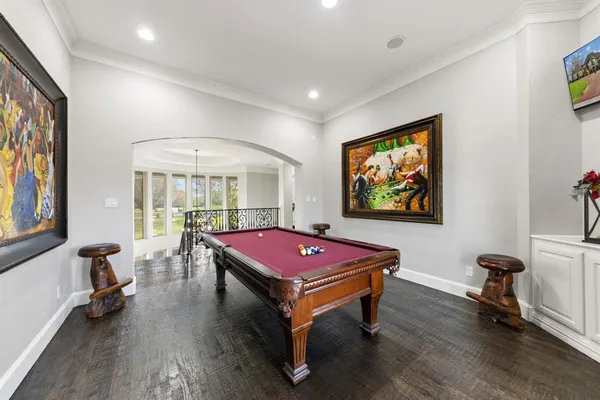 a living room with furniture a rug and a flat screen tv