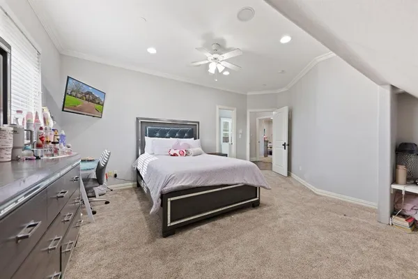 a bedroom with a bed and a couch