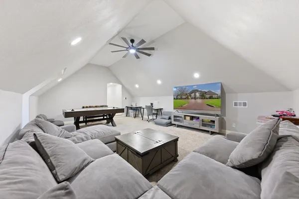 a bedroom with a bed and a couch