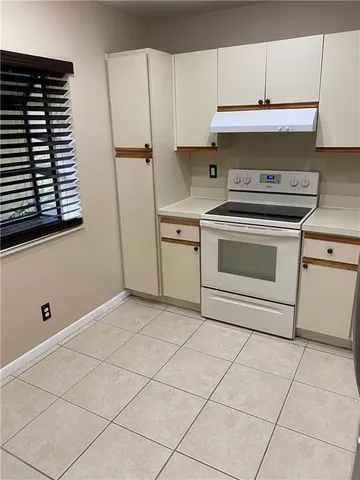 a bathroom with a sink a toilet a mirror and shower