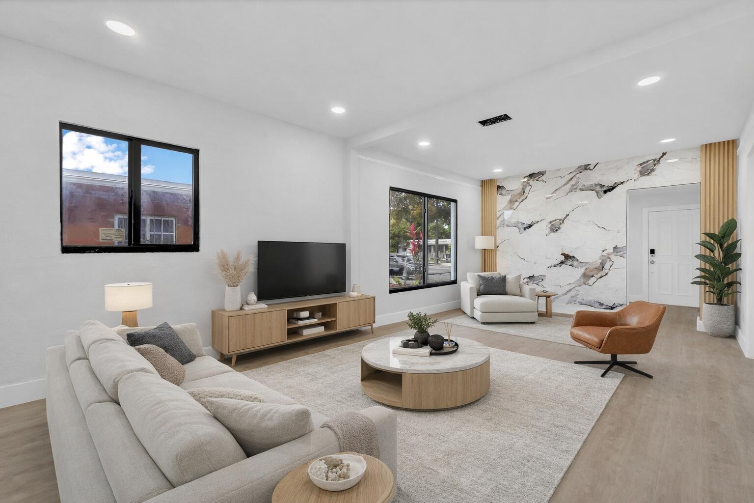 a living room with furniture and a flat screen tv