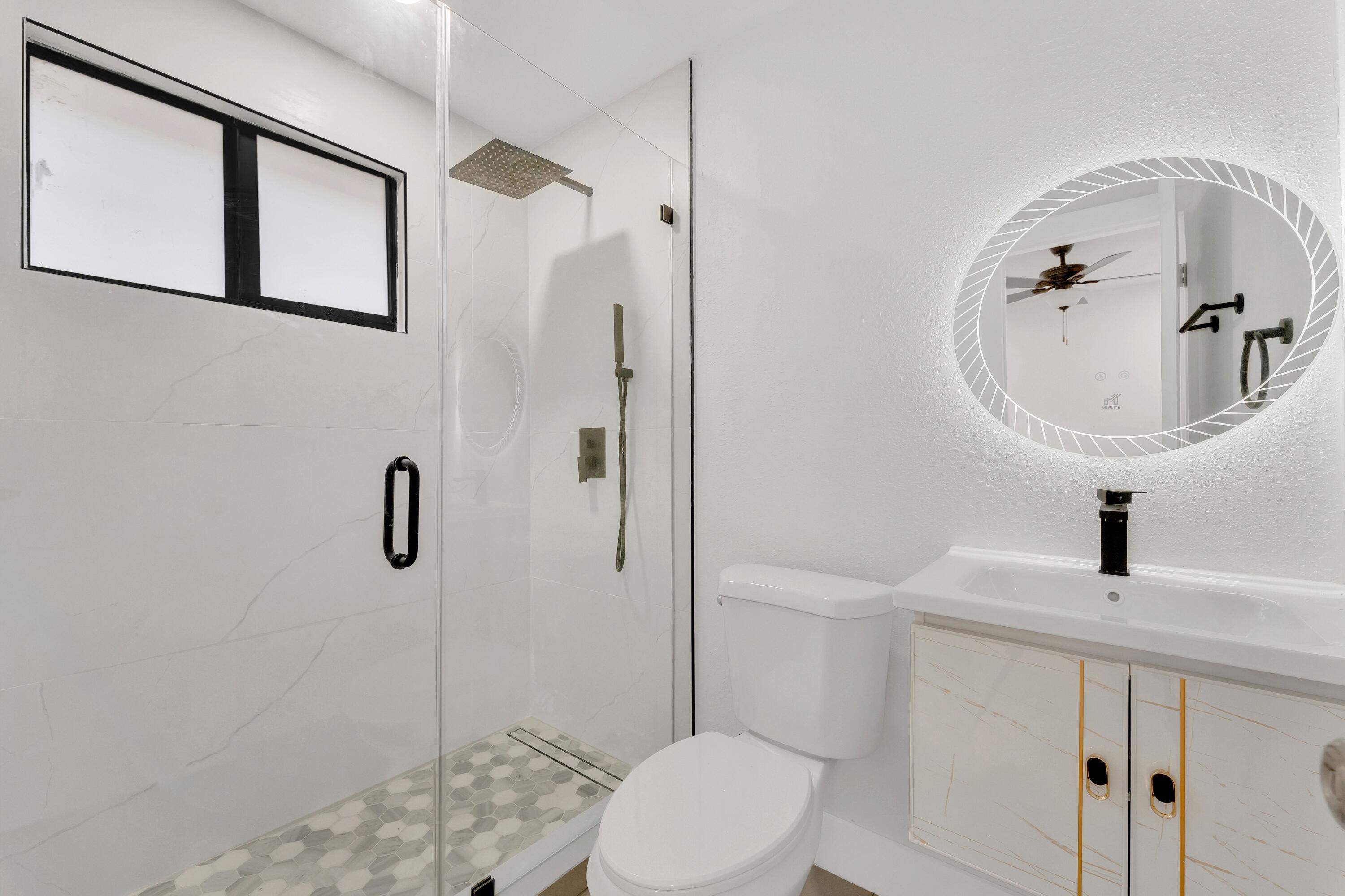 2428 Northwest 28th Street Miami, FL 33142 - Photo 11 of 19 a bathroom with a sink a toilet and shower