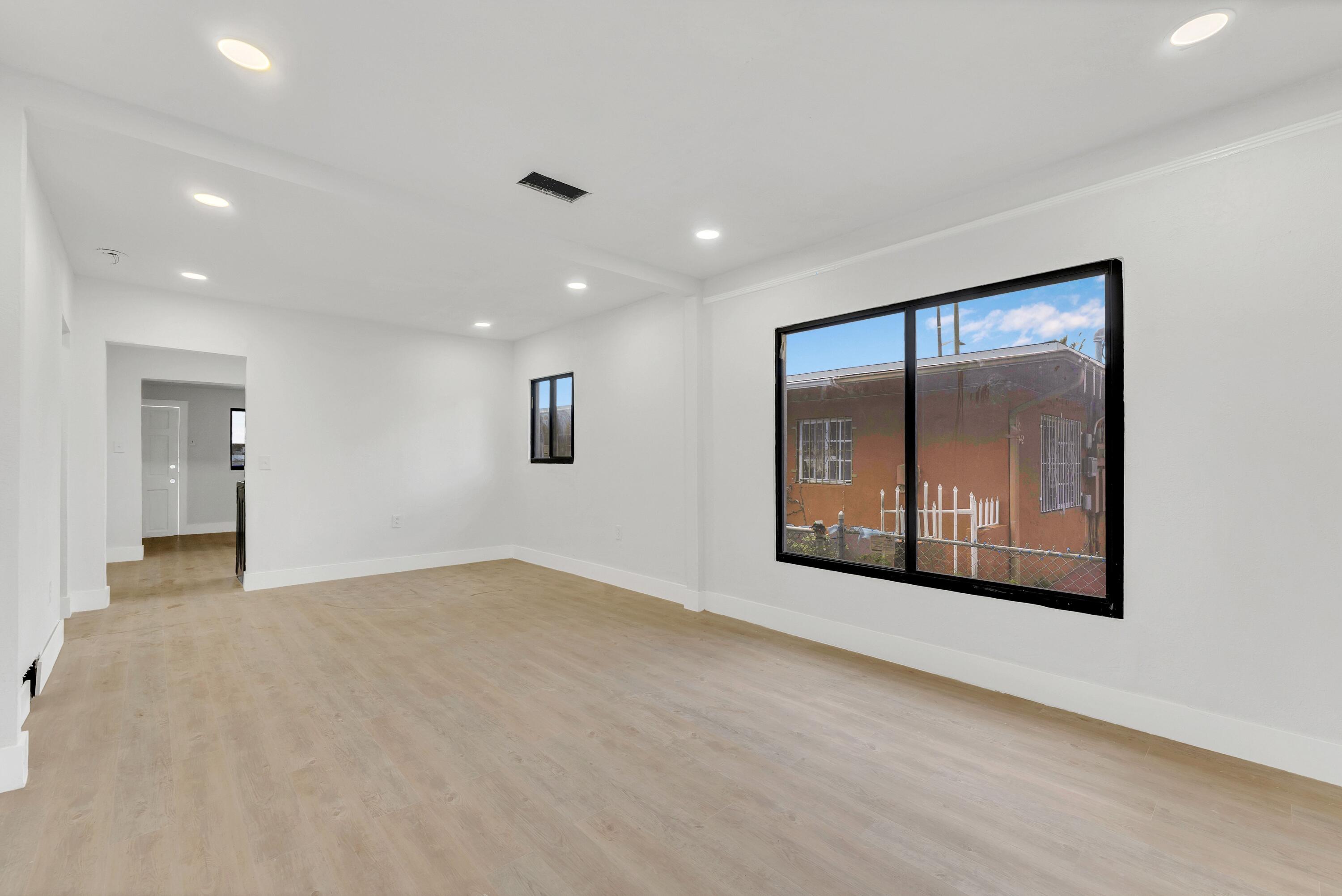 2428 Northwest 28th Street Miami, FL 33142 - Photo 3 of 19 a view of an empty room with a window