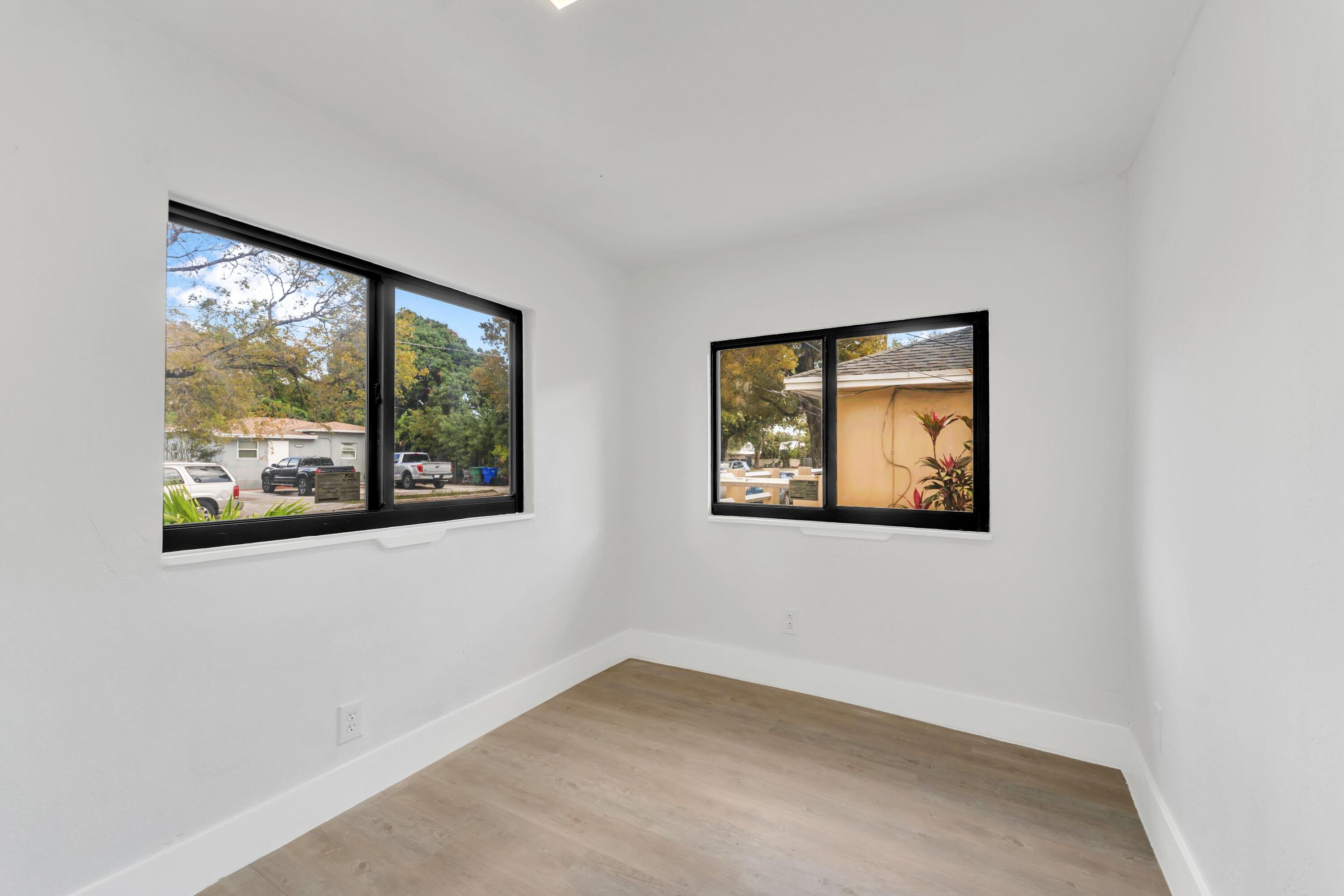 2428 Northwest 28th Street Miami, FL 33142 - Photo 9 of 19 an empty room with window