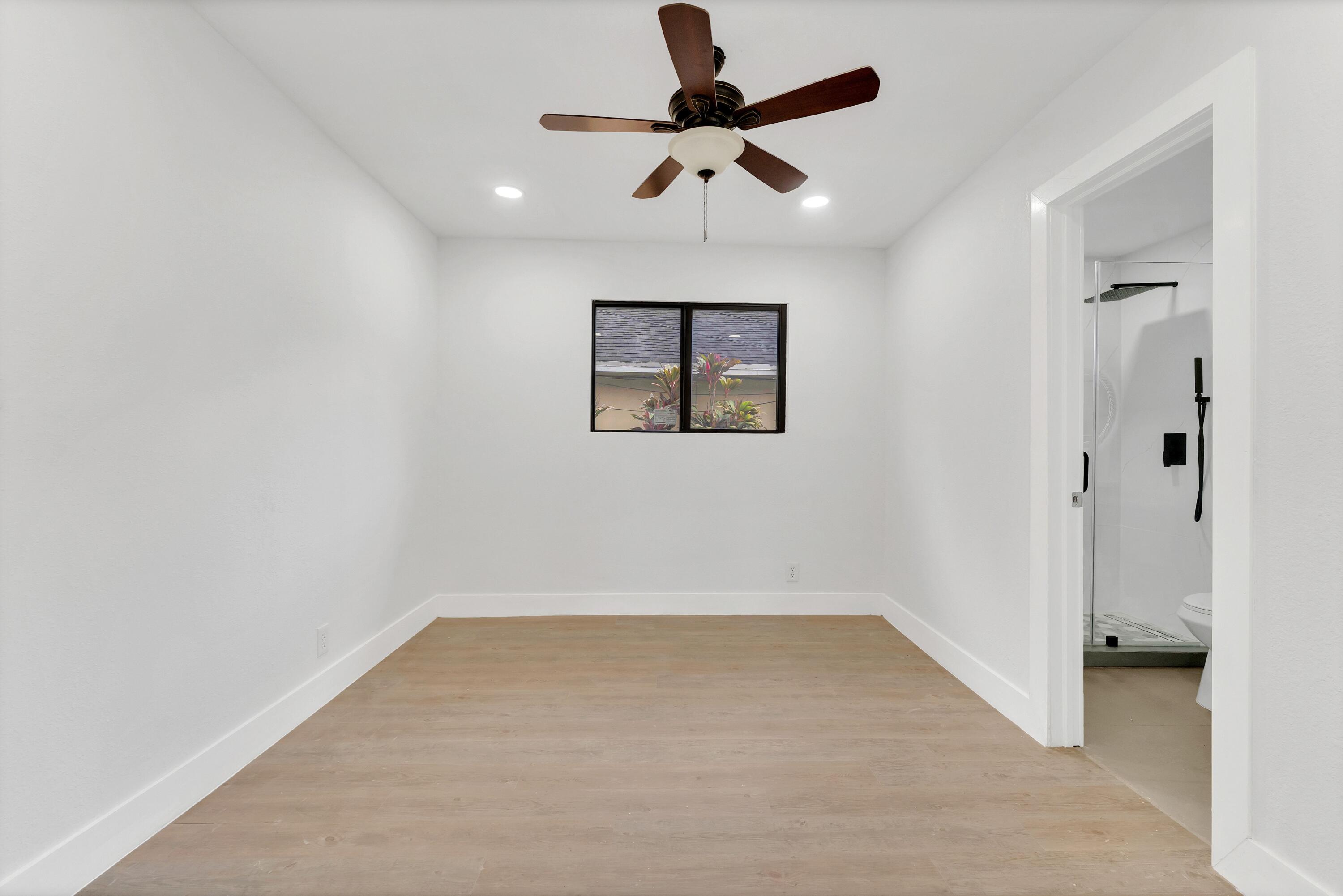 2428 Northwest 28th Street Miami, FL 33142 - Photo 10 of 19 wooden floor in an empty room