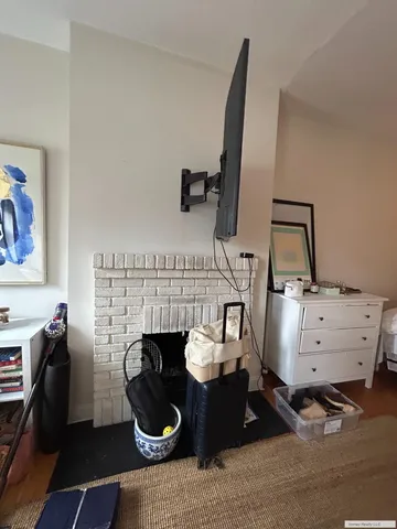 a room with furniture and a fireplace