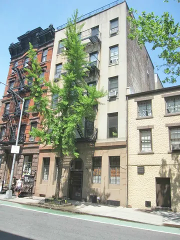 a room with gym equipment and a mirror
