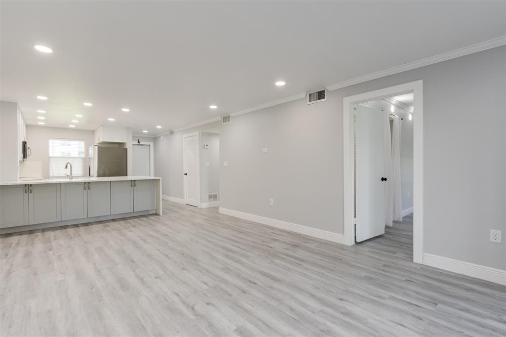 9856 Marina Boulevard, Unit 1314 Boca Raton, FL 33428 - Photo 15 of 43 a view of an empty room with wooden floor