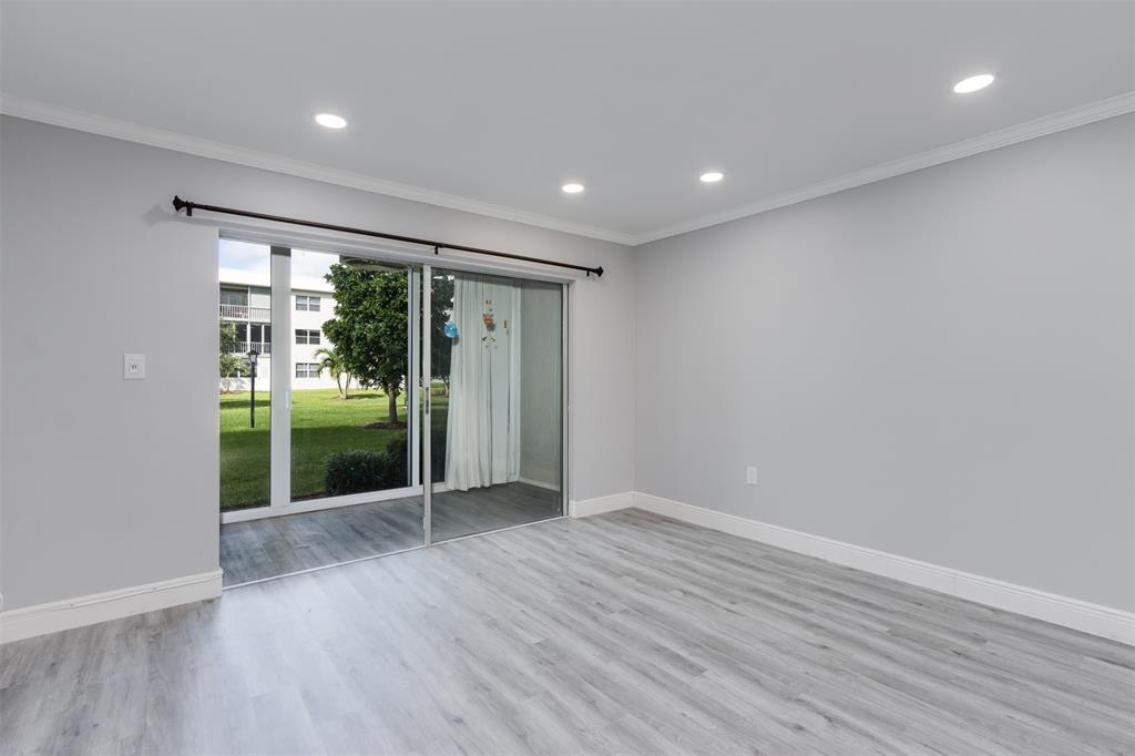 9856 Marina Boulevard, Unit 1314 Boca Raton, FL 33428 - Photo 20 of 43 a view of hallway with wooden floor