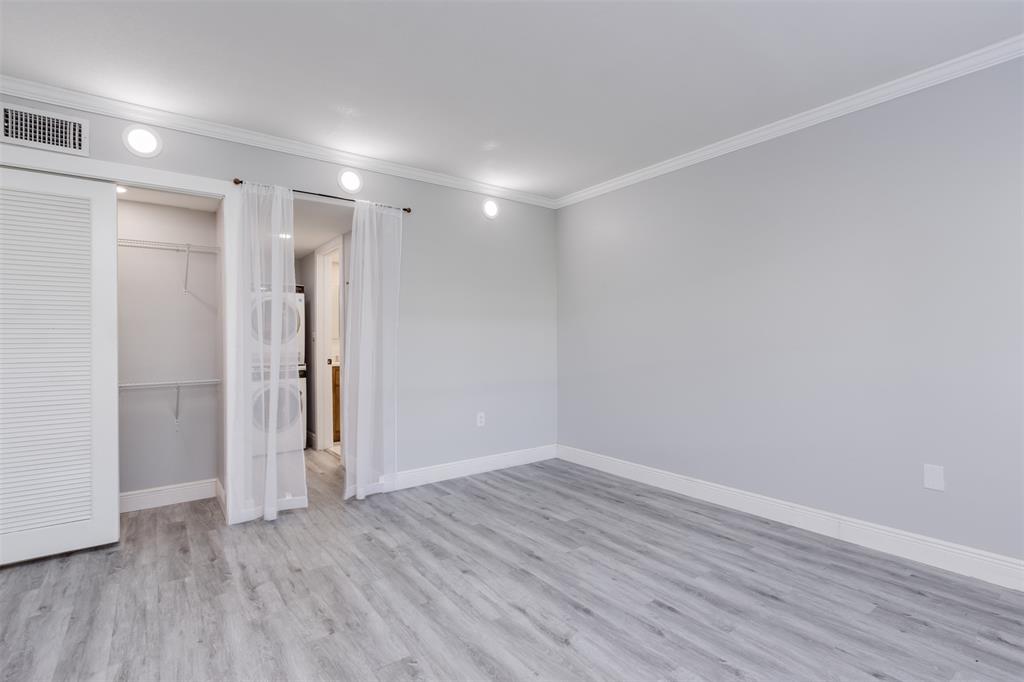 9856 Marina Boulevard, Unit 1314 Boca Raton, FL 33428 - Photo 24 of 43 a view of empty room with wooden floor