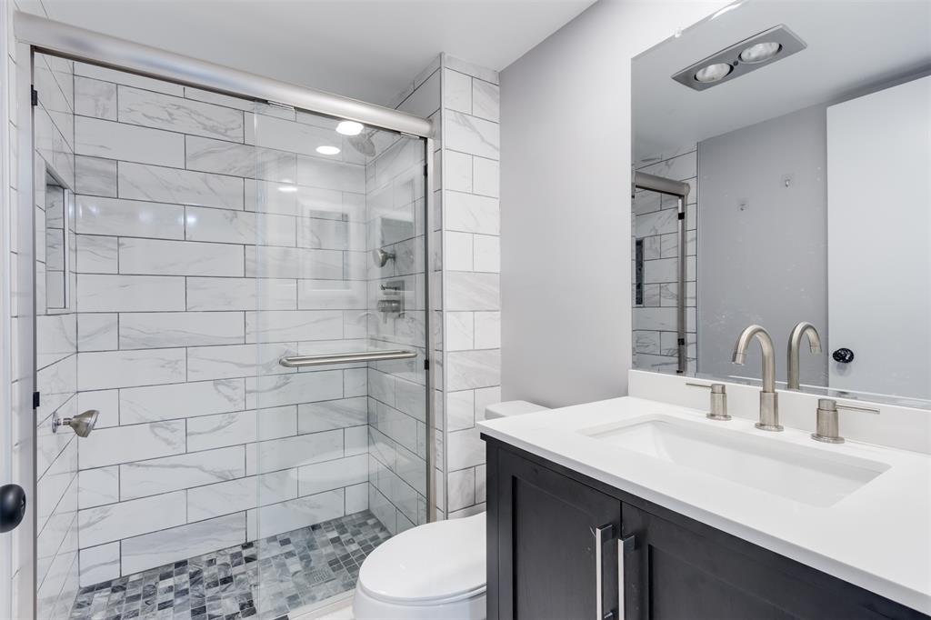 9856 Marina Boulevard, Unit 1314 Boca Raton, FL 33428 - Photo 34 of 43 a bathroom with a sink a toilet and shower