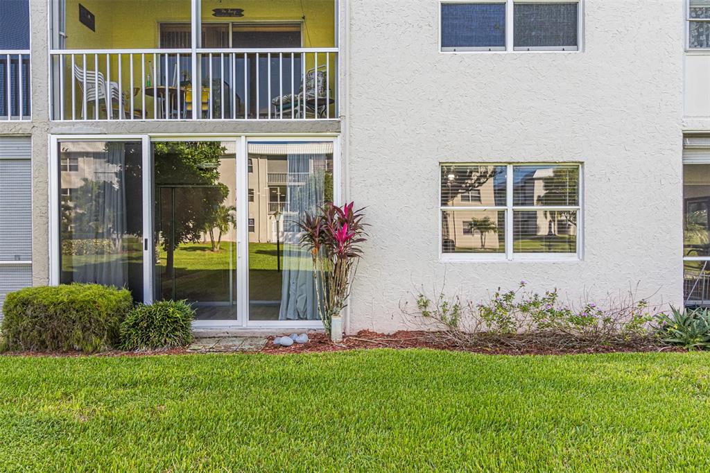 9856 Marina Boulevard, Unit 1314 Boca Raton, FL 33428 - Photo 39 of 43 a front view of a house with a garden