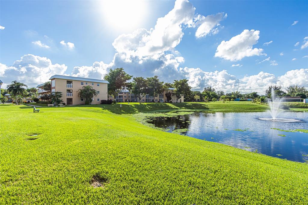 9856 Marina Boulevard, Unit 1314 Boca Raton, FL 33428 - Photo 4 of 43 a view of a lake with houses