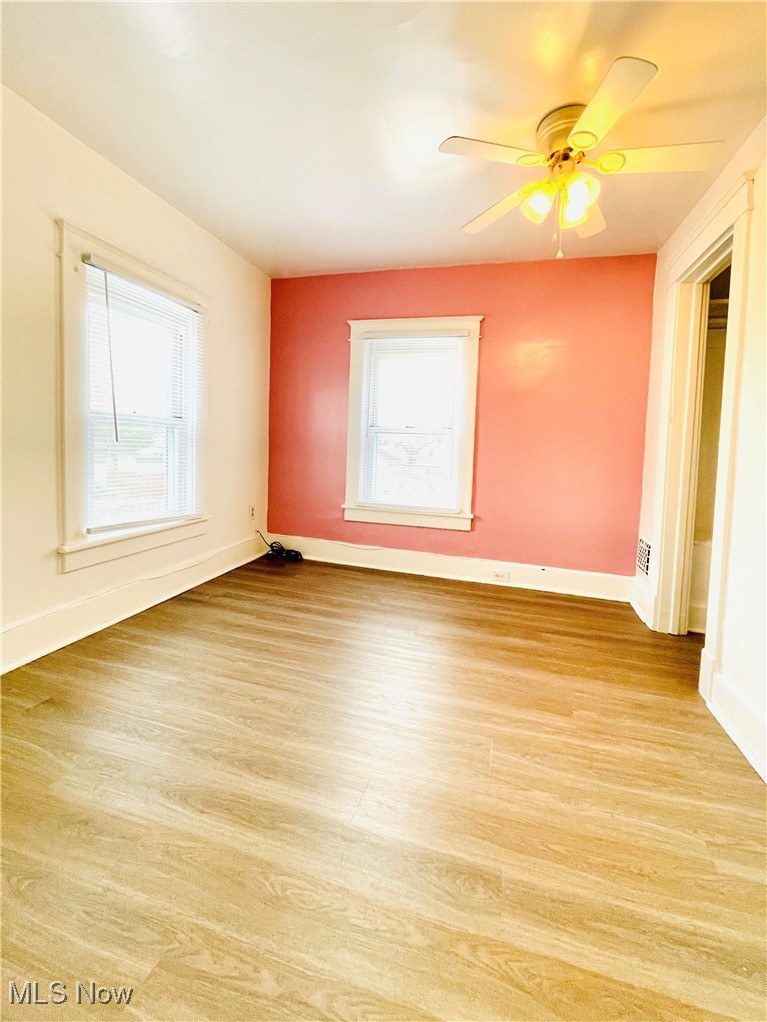 495 5th Street Struthers, OH 44471 - Photo 17 of 26 Unfurnished room featuring ceiling fan and light hardwood / wood-style flooring