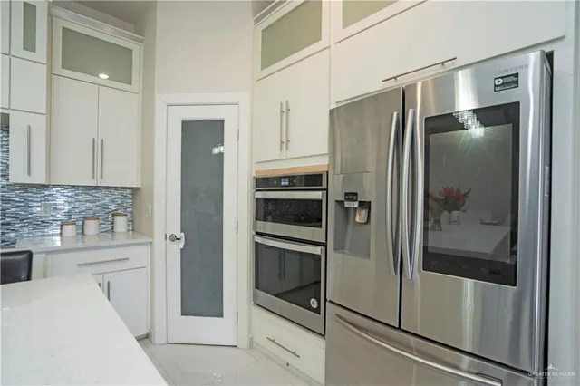 a bathroom with a shower and a sink