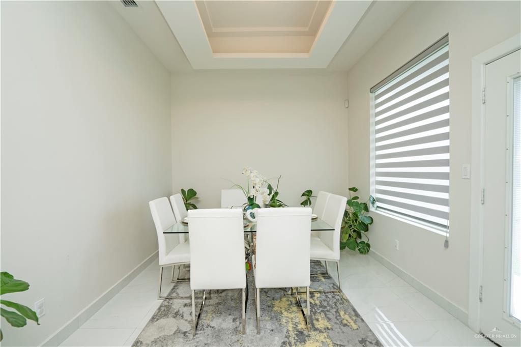 2008 South Erica Street Pharr, TX 78577 - Photo 12 of 25 a view of a dining room with furniture and a window