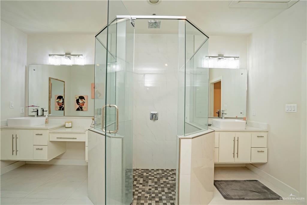 2008 South Erica Street Pharr, TX 78577 - Photo 14 of 25 a bathroom with a shower a sink and a mirror