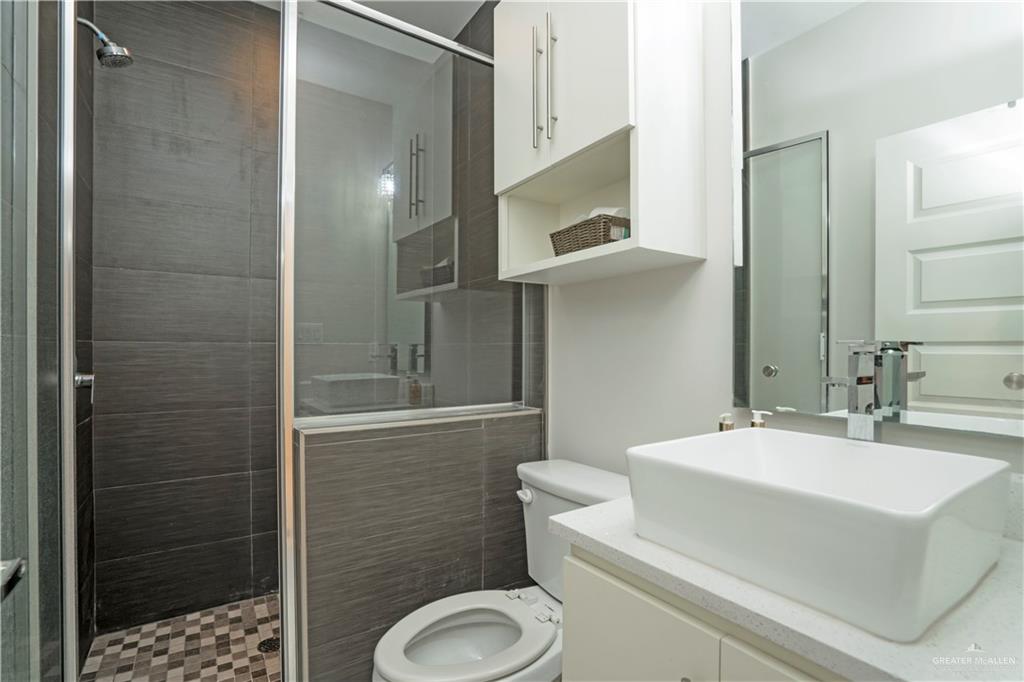 2008 South Erica Street Pharr, TX 78577 - Photo 22 of 25 a bathroom with a sink toilet and shower