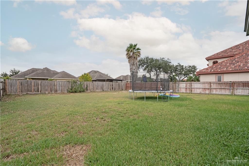 2008 South Erica Street Pharr, TX 78577 - Photo 23 of 25 a view of a house with backyard and trampoline