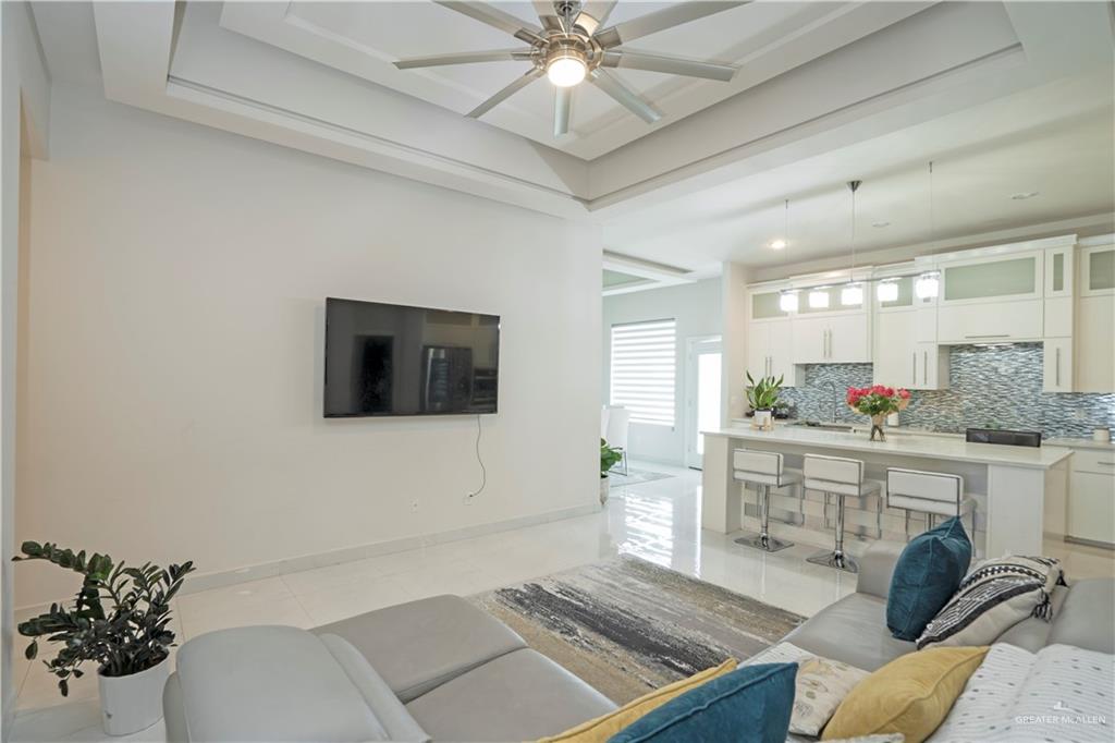 2008 South Erica Street Pharr, TX 78577 - Photo 5 of 25 a living room with furniture and a flat screen tv
