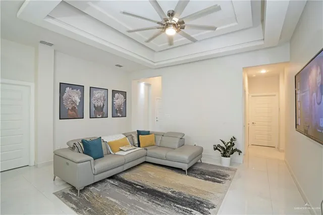 a living room with furniture and a rug