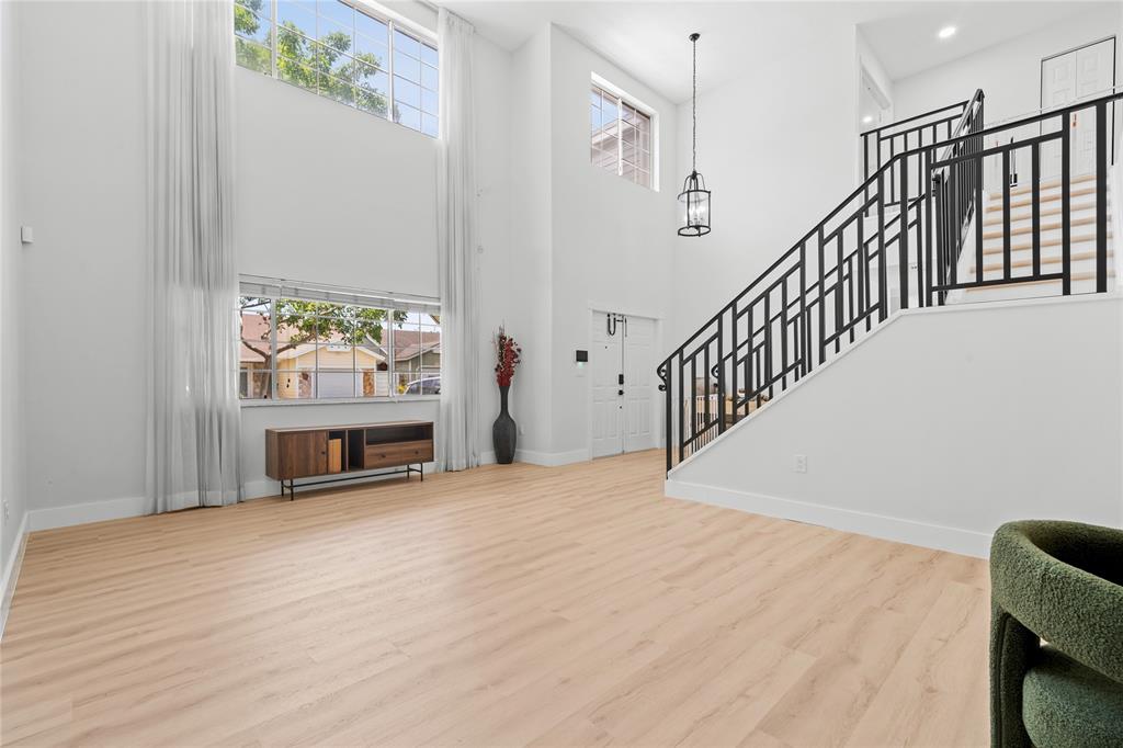 14908 Southwest 143rd Place Miami, FL 33186 - Photo 13 of 45 a view of an empty room with a window and a fireplace