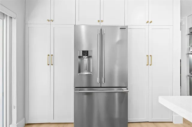 a view of walk in closet with white walls