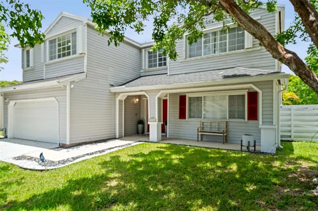 a view of a house with backyard