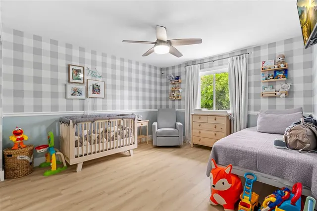 a bedroom with furniture and a window