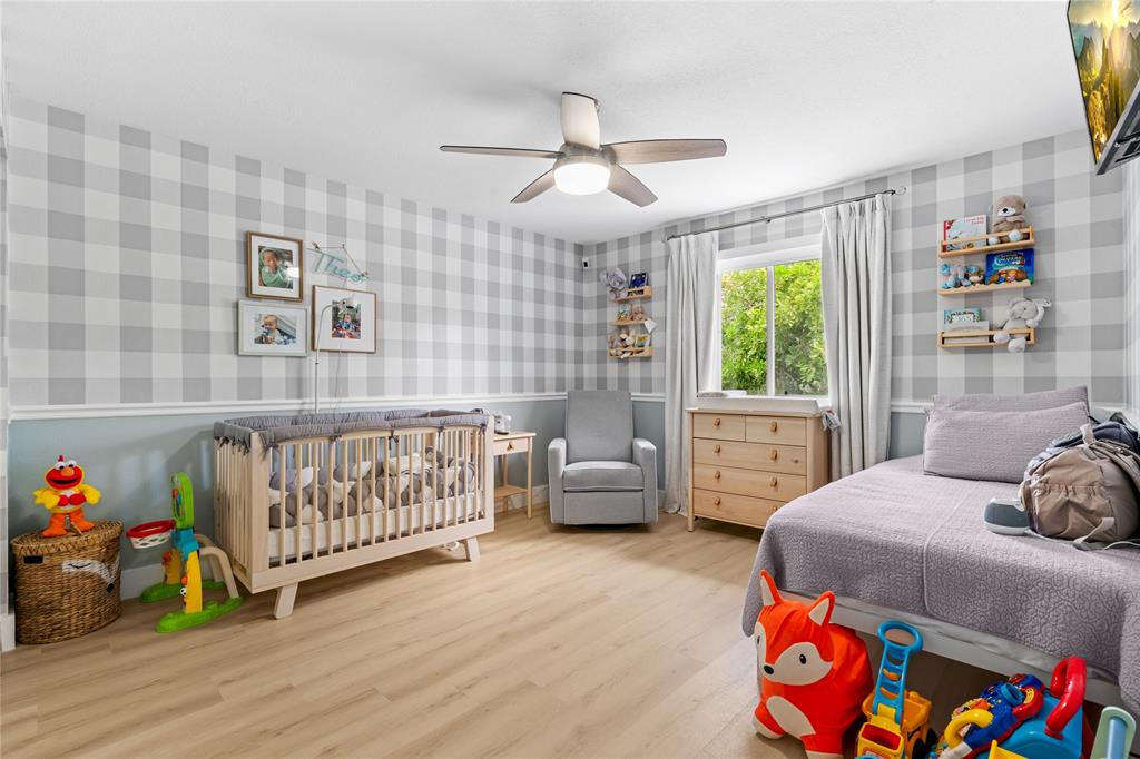 14908 Southwest 143rd Place Miami, FL 33186 - Photo 34 of 45 a bedroom with furniture and a window