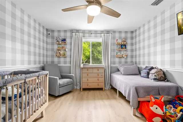 a bedroom with furniture and a window