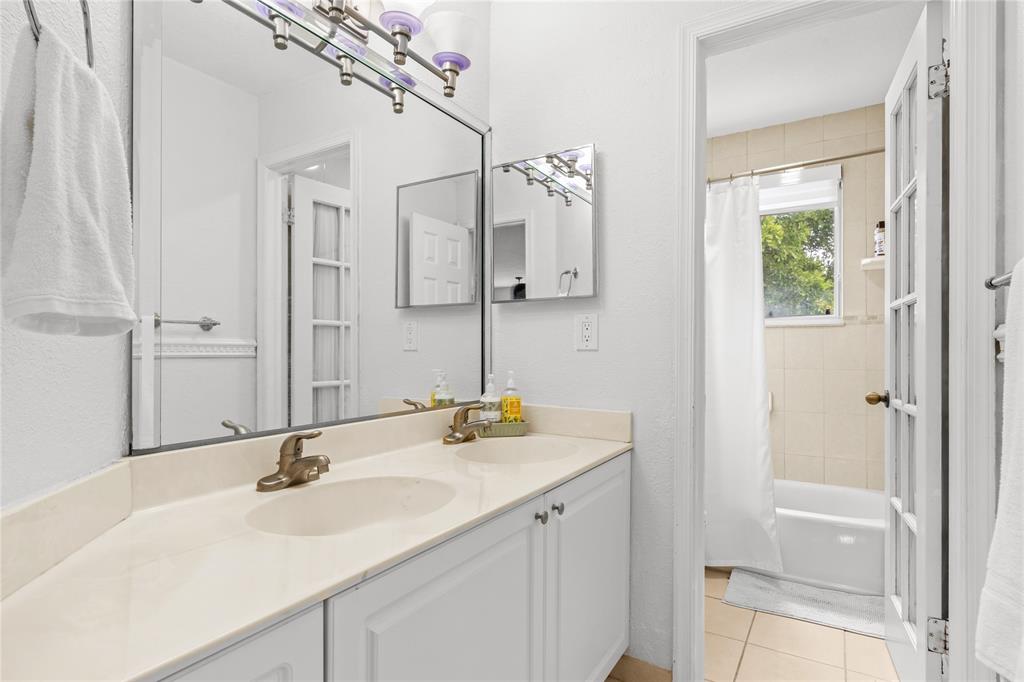 14908 Southwest 143rd Place Miami, FL 33186 - Photo 37 of 45 a bathroom with a sink and a mirror