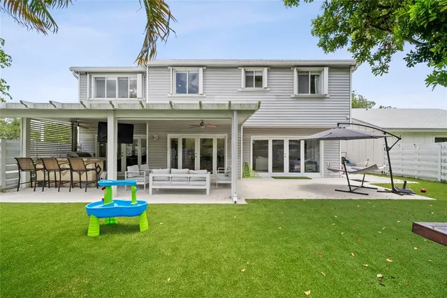 a house view with a sitting space and garden