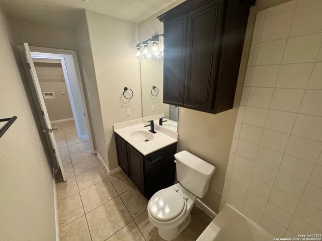 a view of a hallway with chandelier and entryway